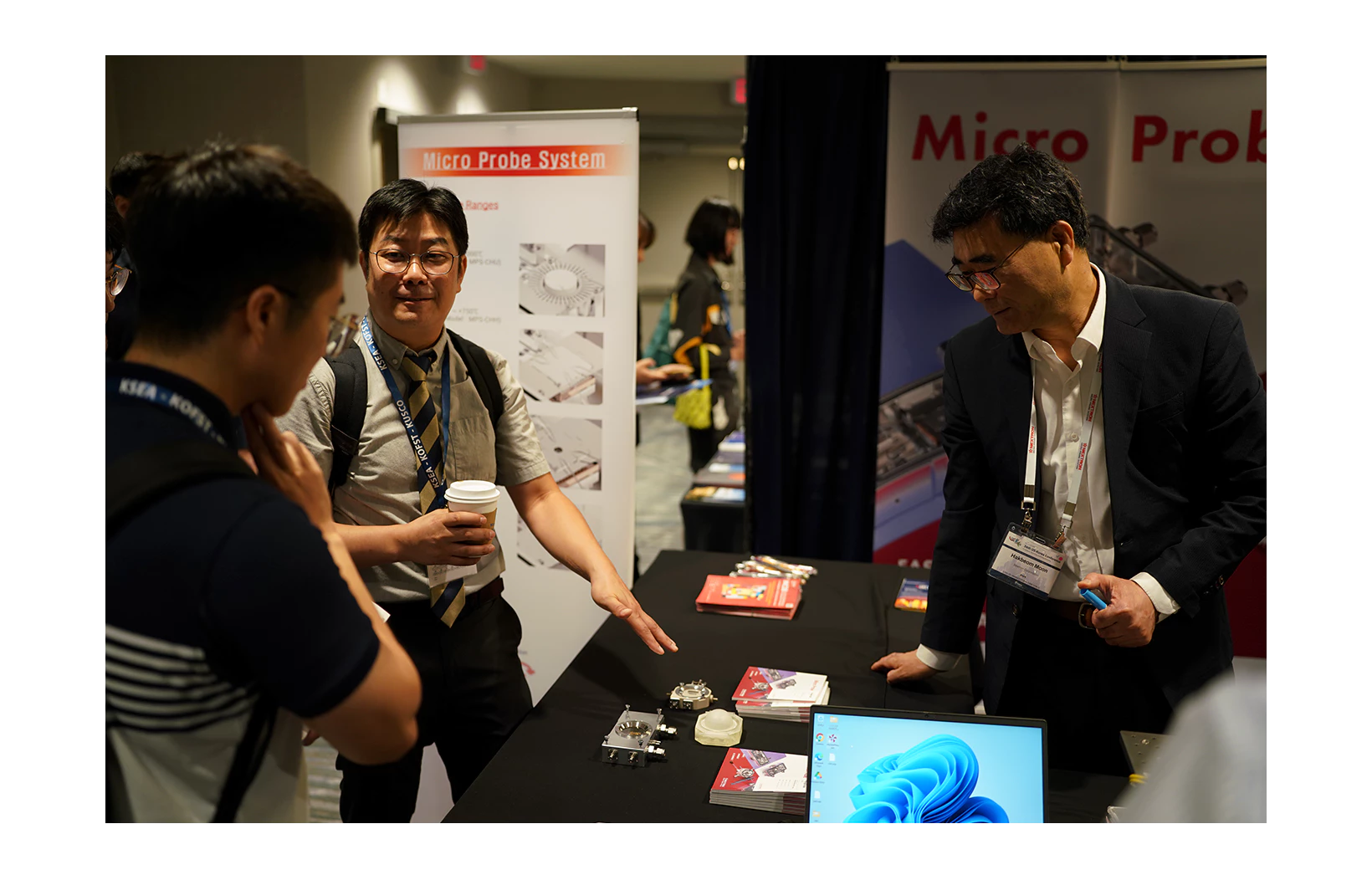 Customer talking about XRD and in-situ Raman cell to other customers at 2023 KSEA
