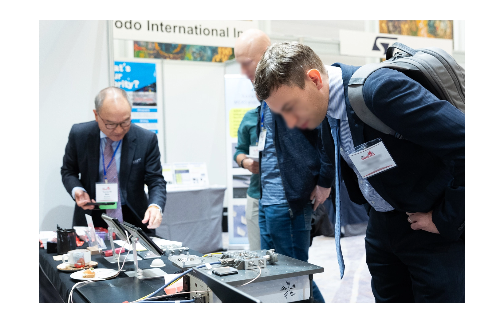 Branch manager smiling at the camera at 2023 IEEE Sensors